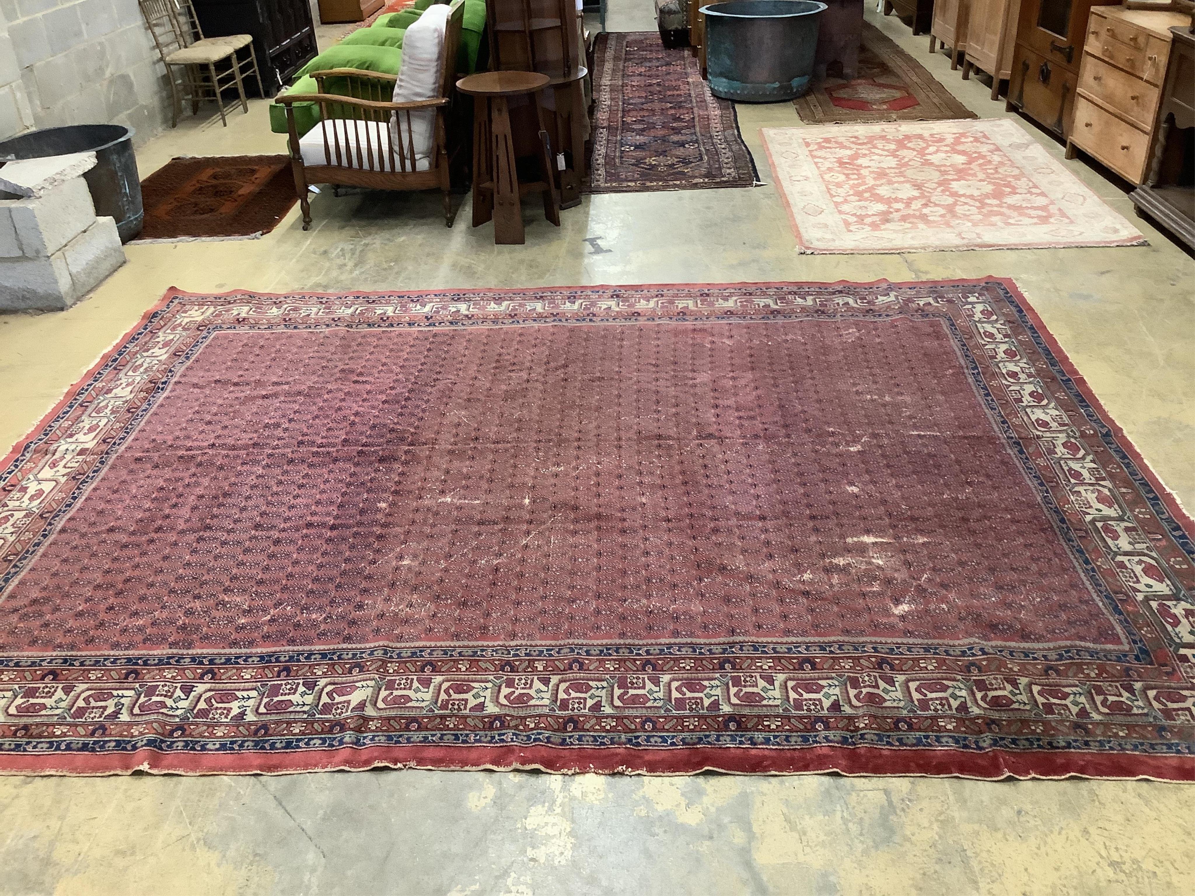 A Salouk red ground carpet, 350 x 265cm. Condition - poor to fair